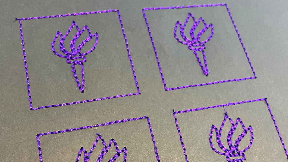 Machine embroidered purple NYU logo torches on gray card, NYU ITP Project Fellowship